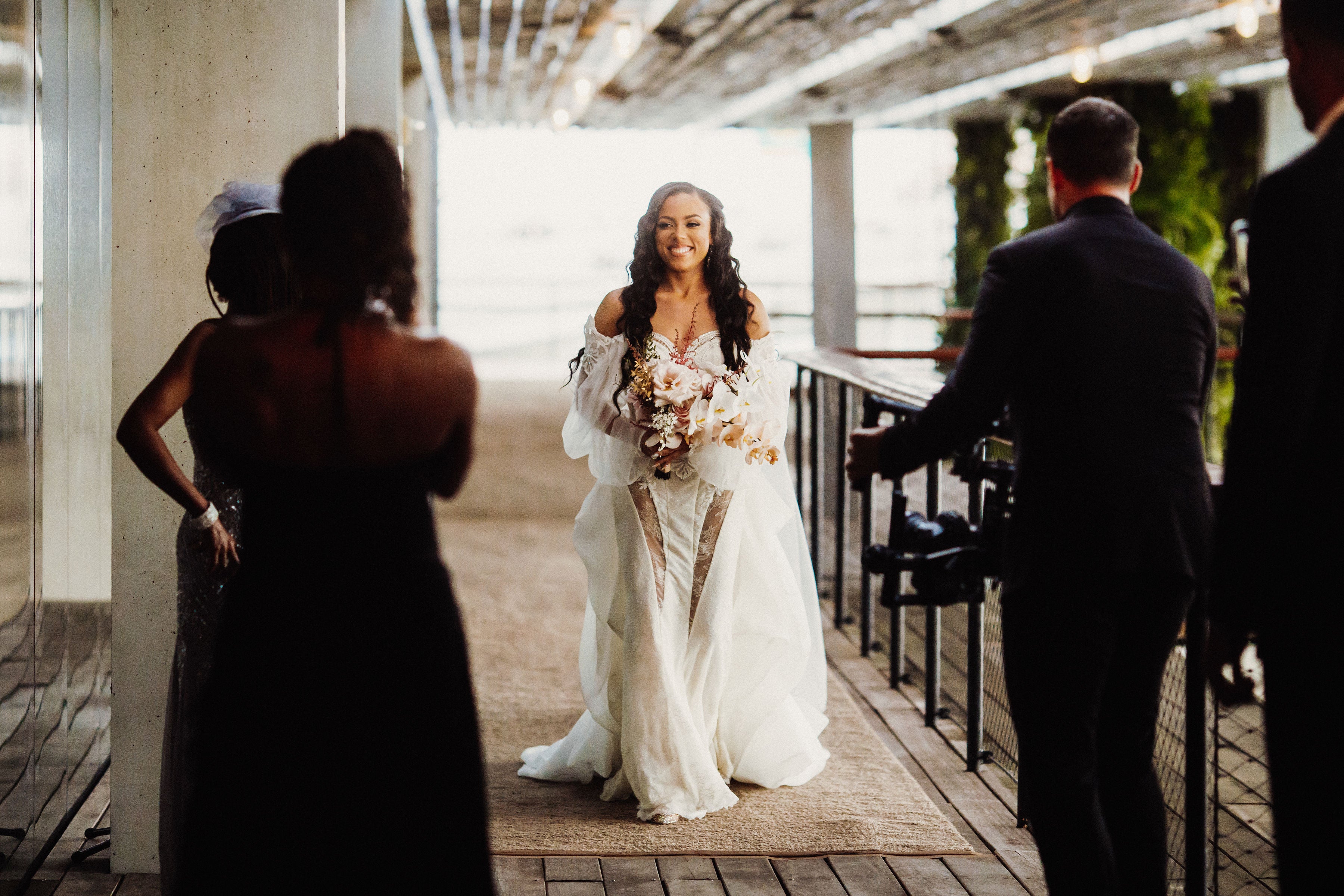 GL Bride Jessica walking to meet family and friend in our Thelma gown