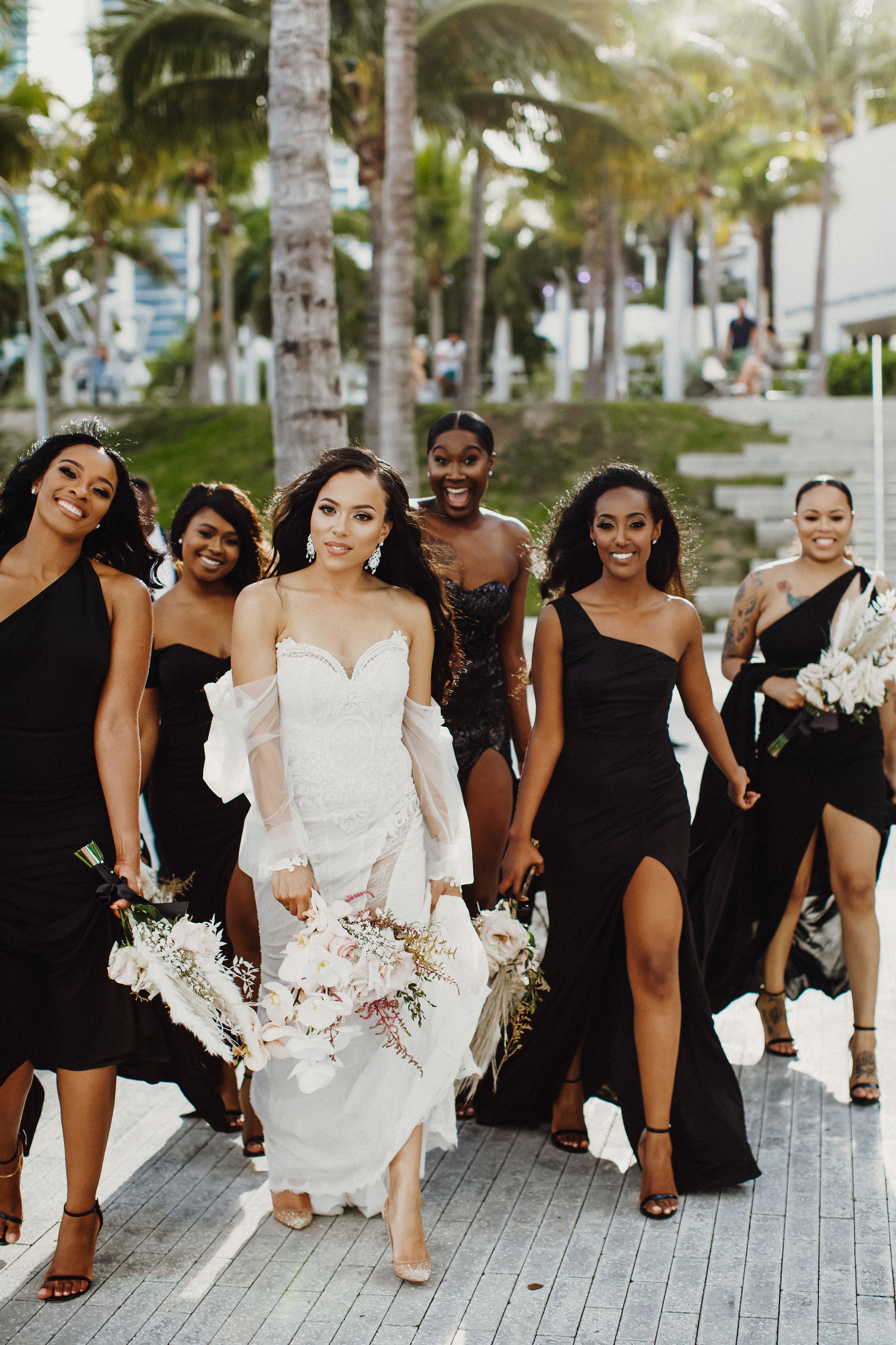 GL Bride Jessica wearing the Thelma gown walking with her bridesmaids