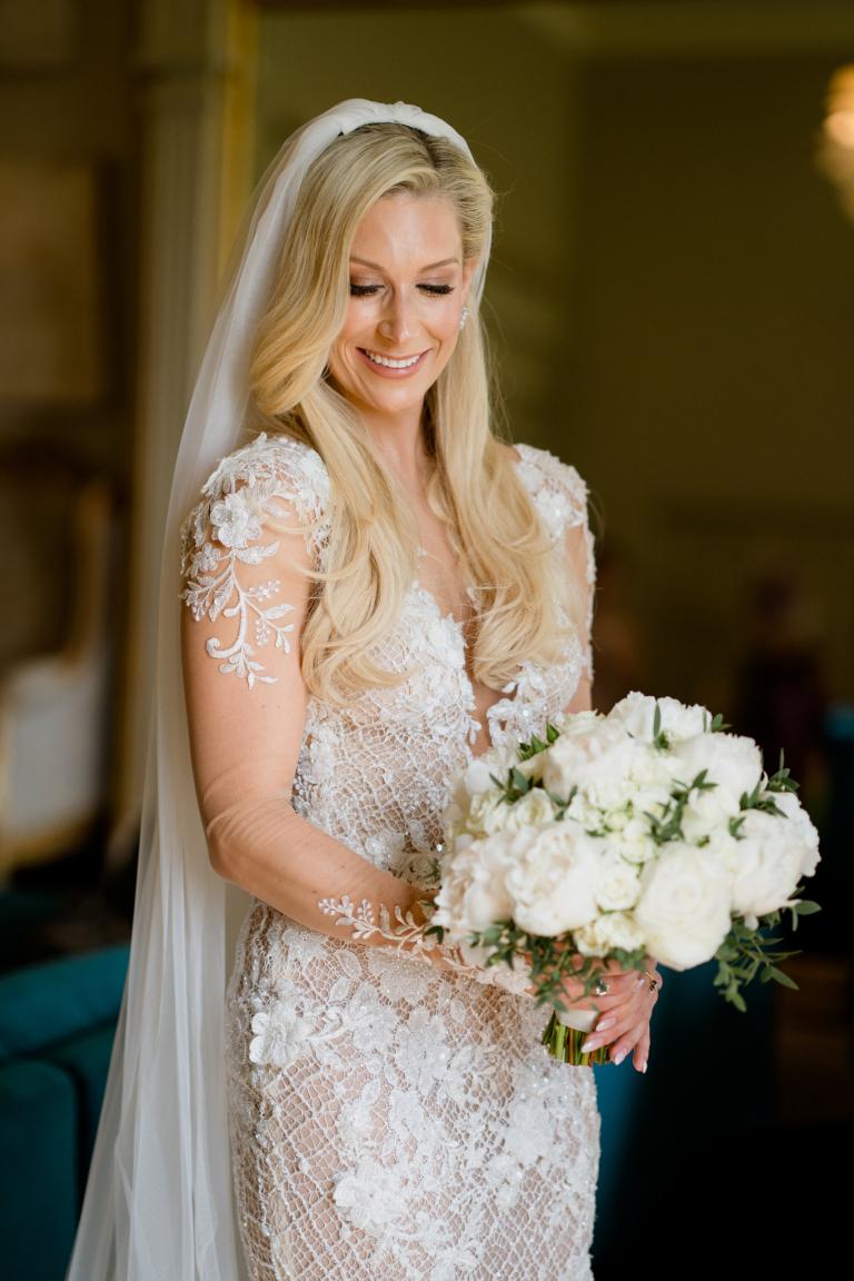 GL Bride Charlotte wearing our Rhiannon holding her bouquet
