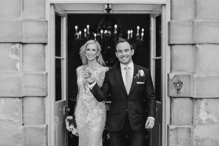 GL Bride Charlotte wearing our Rhiannon walking with her husband