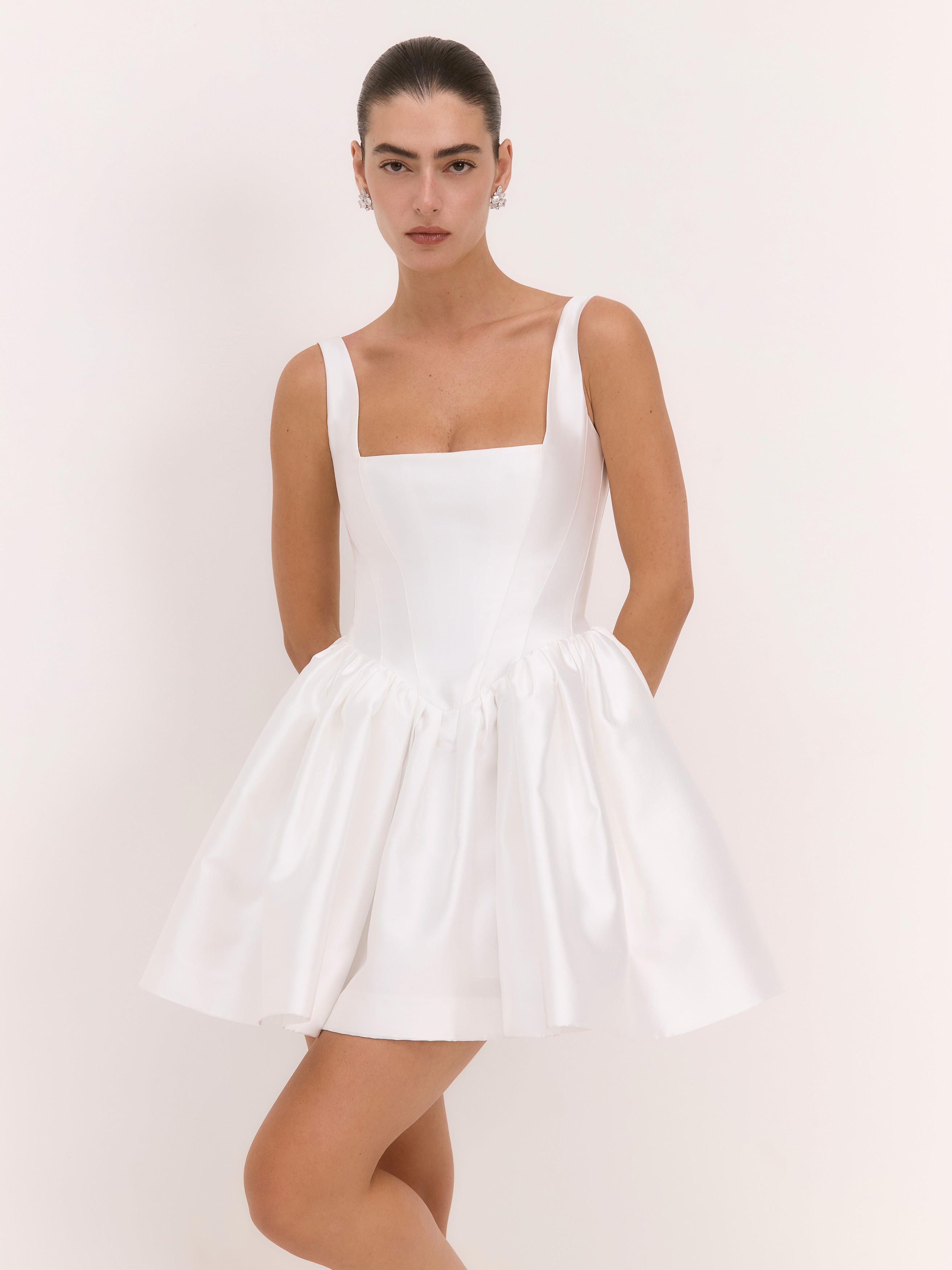 White dress worn by a model on a white background