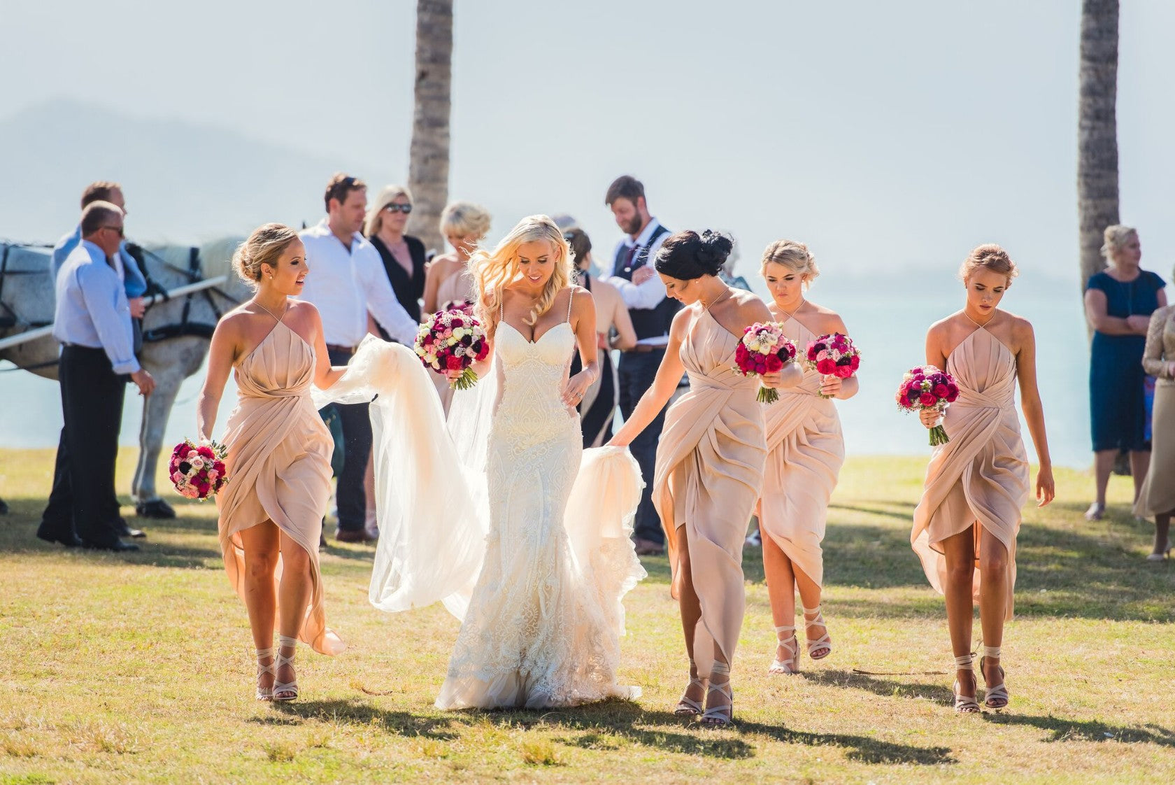 GL Bride Elise wearing our Greta Garbo walking with her bridesmaids 