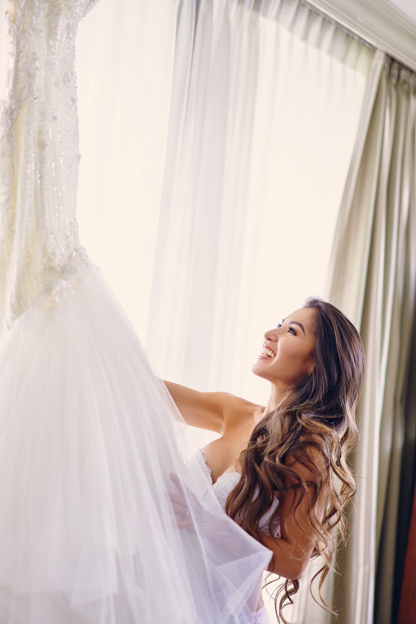 GL Bride Anita getting ready to wearing our Ms. Elle gown