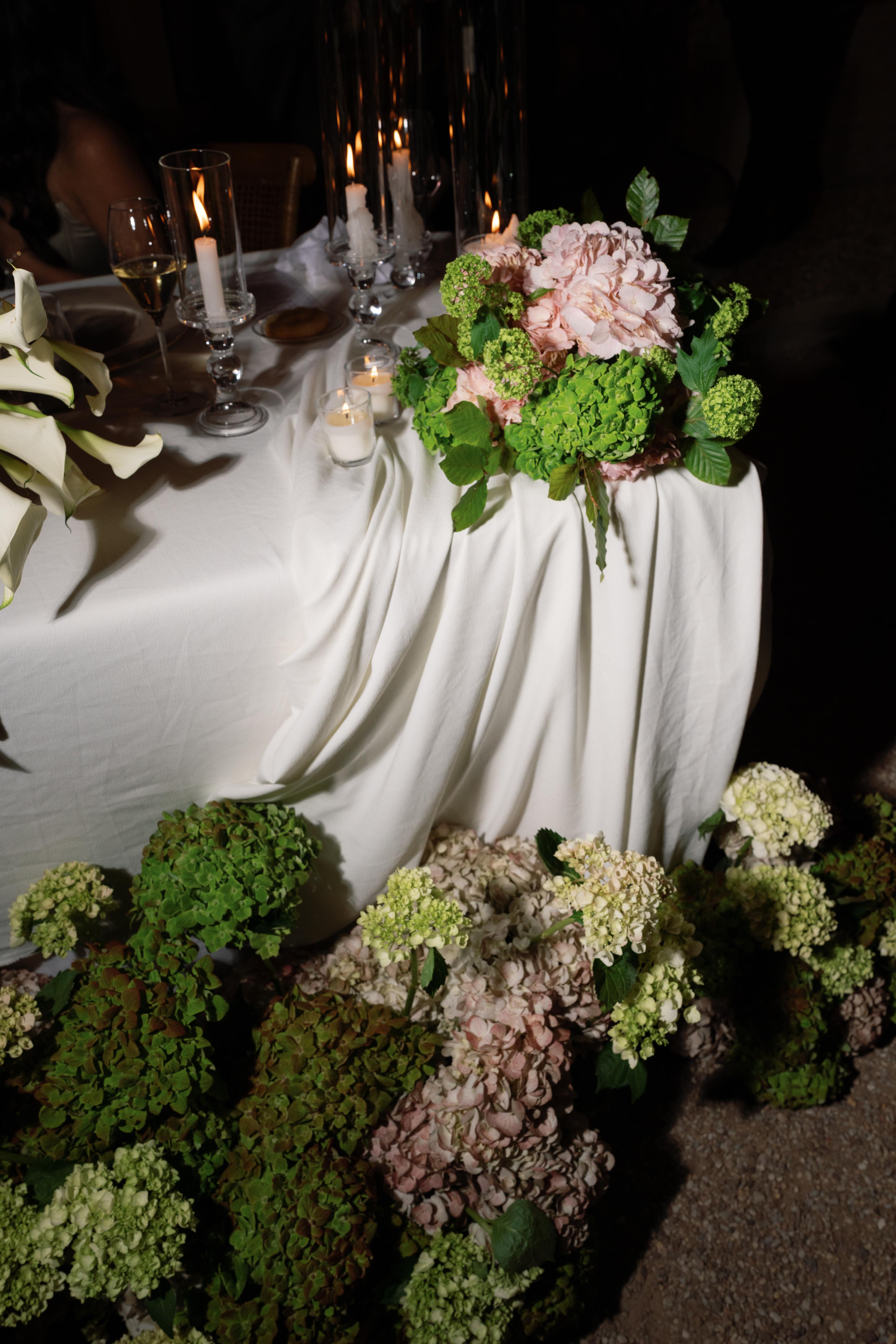 Decorative floral arrangement on a table with white tablecloth