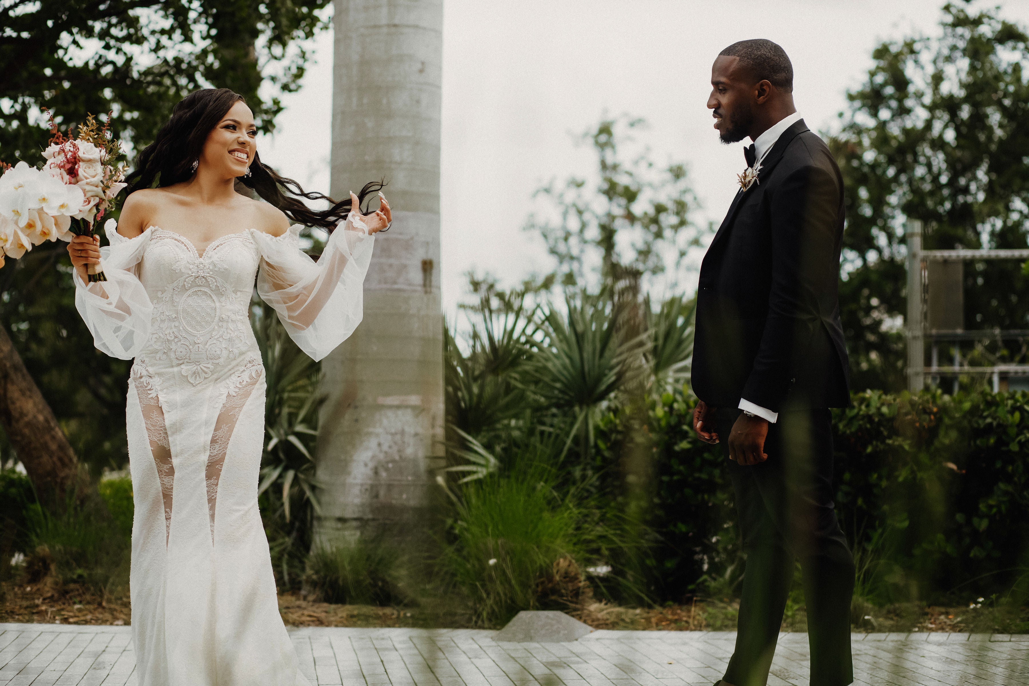 GL Bride Jessica standing with her groom wearing the Thelma gown