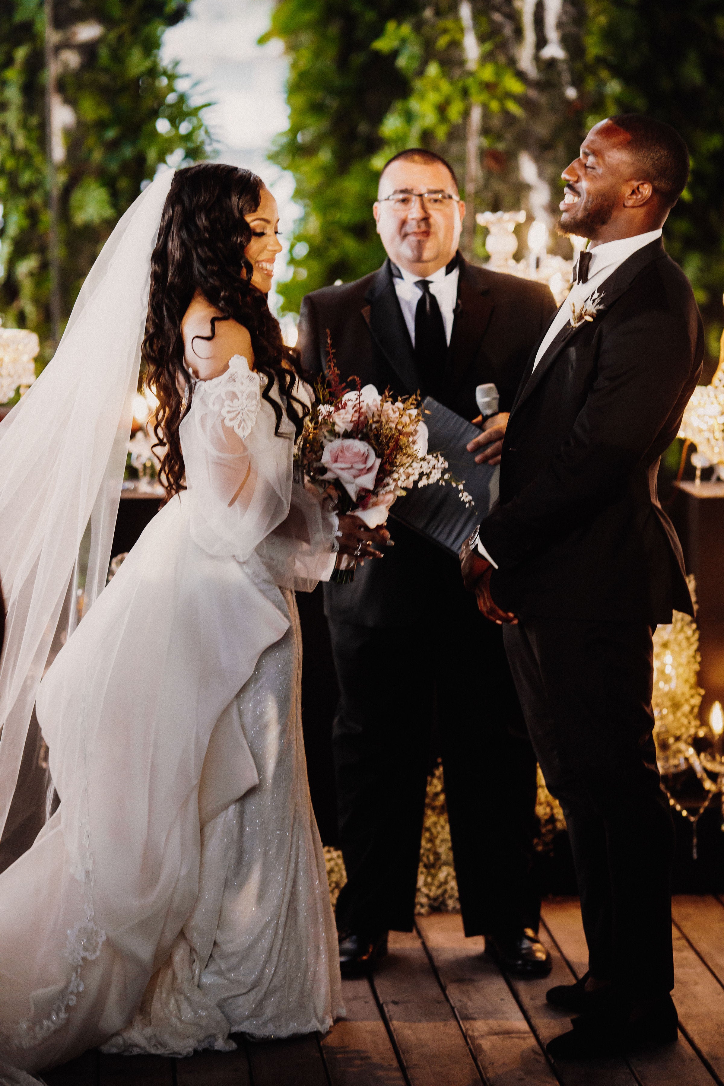 GL Bride Jessica in our Thelma Gown with her groom at the altar