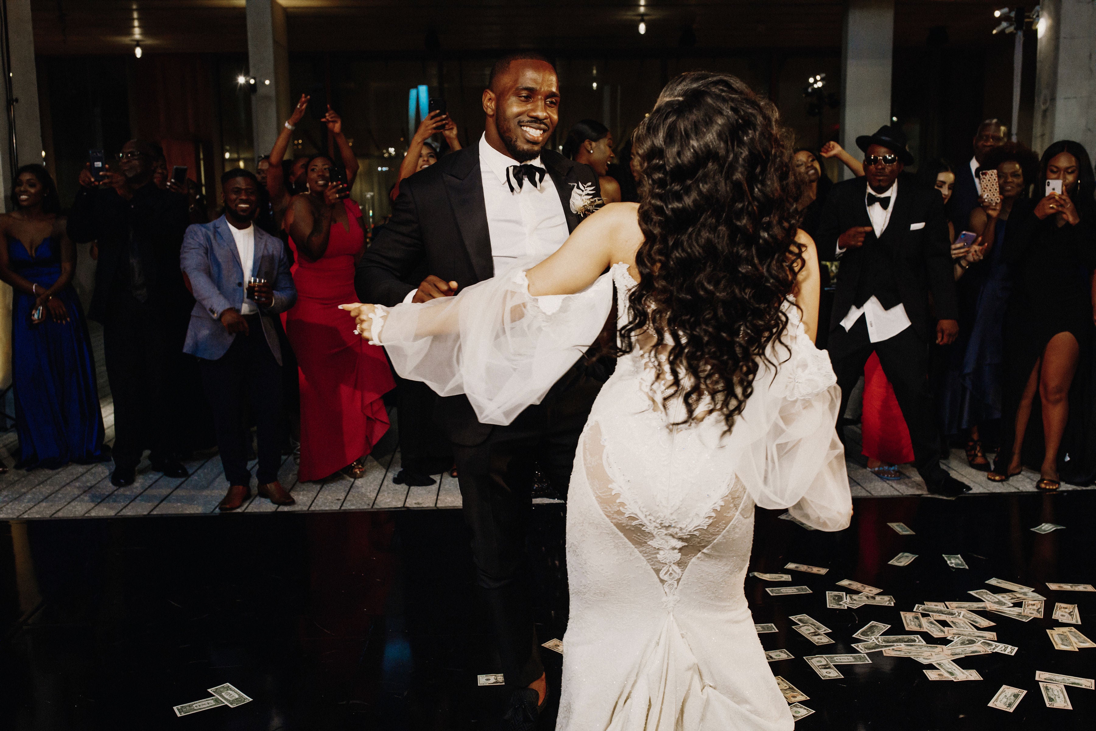 The happy couple dancing on the reception floor 