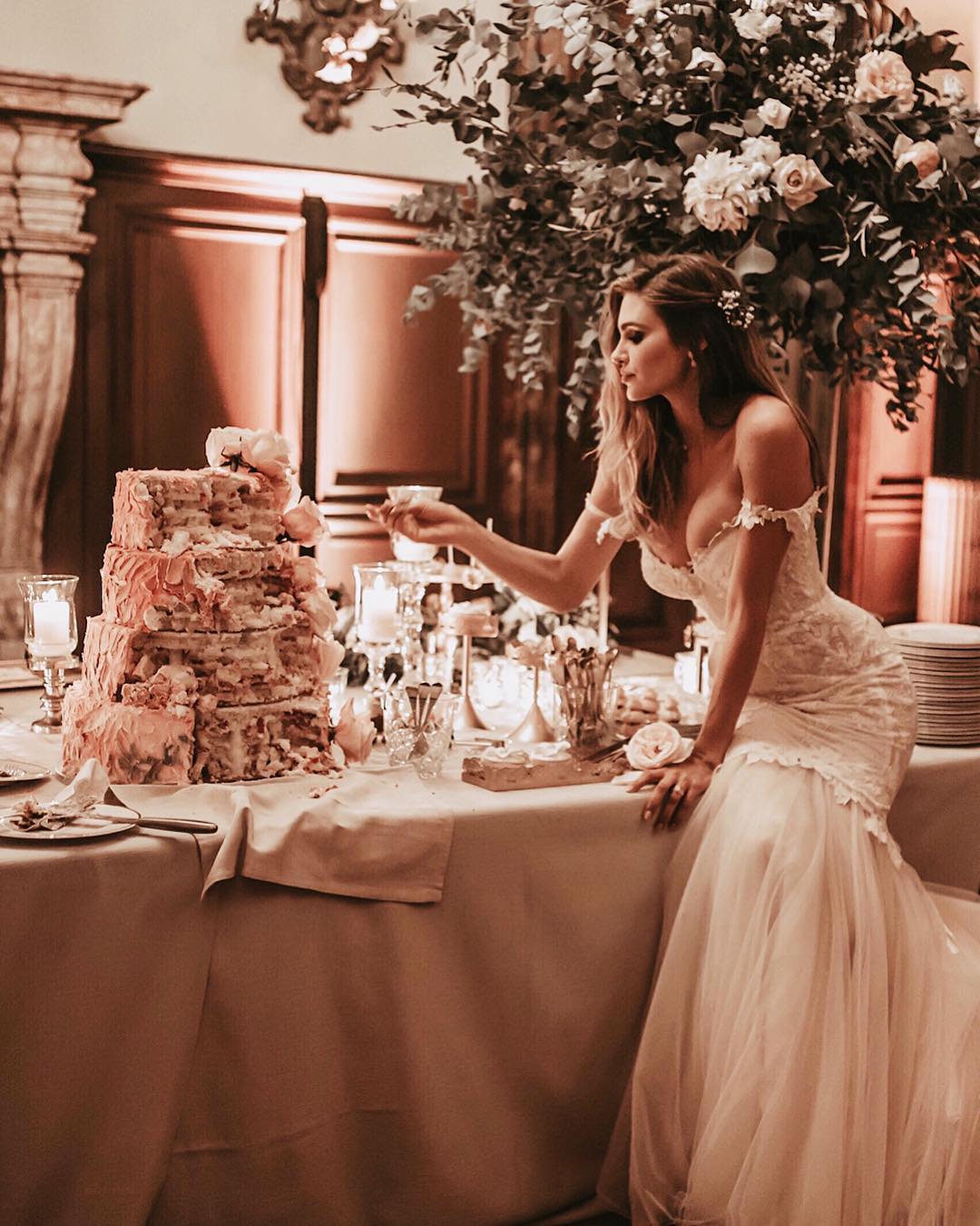 GL Bride Natalie in our Tony gown eating her wedding cake