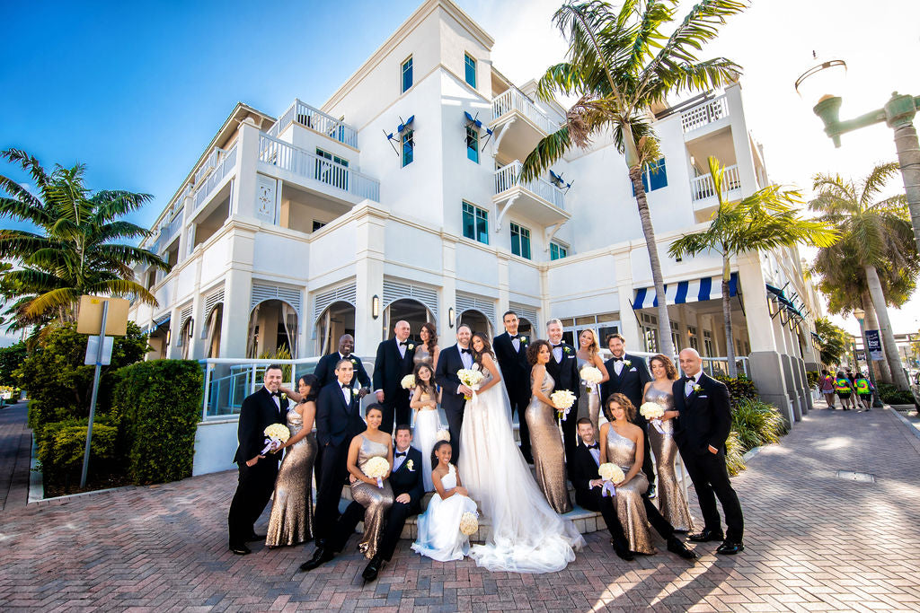 GL Bride Sam in our Gia Gown with her groom and bridal party