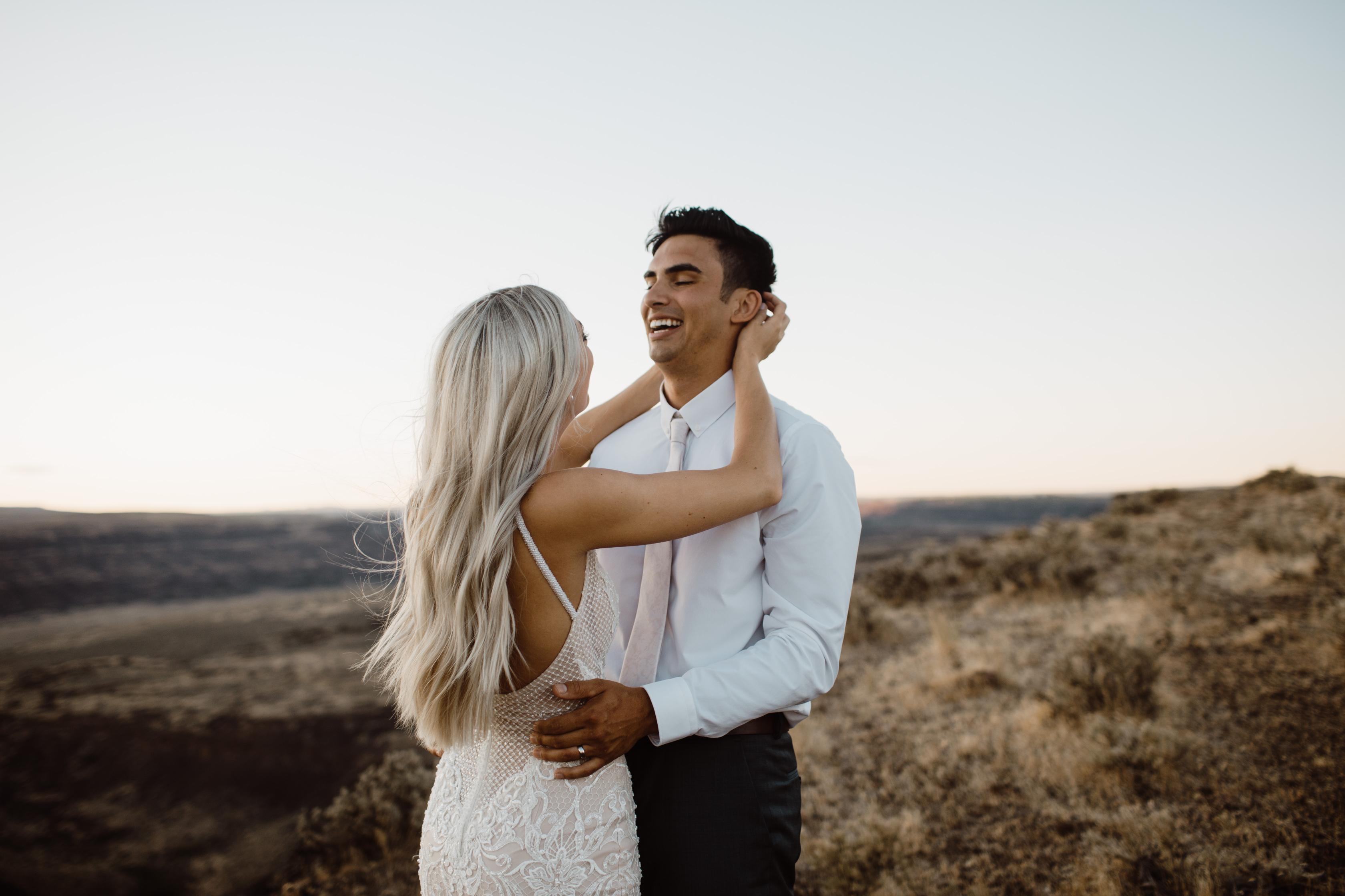 GL Bride Taina wearing the GALA 708 embracing her husband 