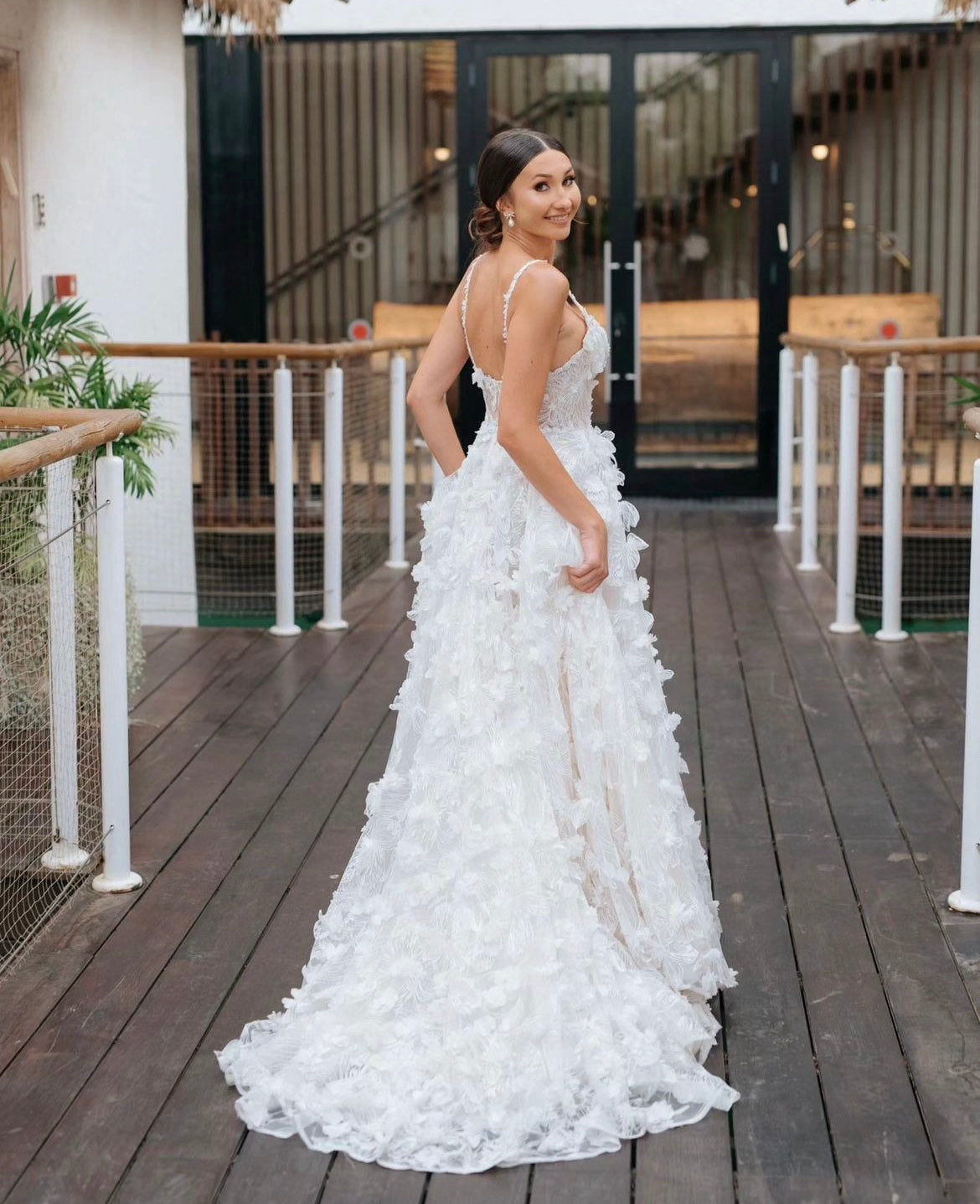 GL Bride Tanya wearing the Fabiana gown walking on the deck