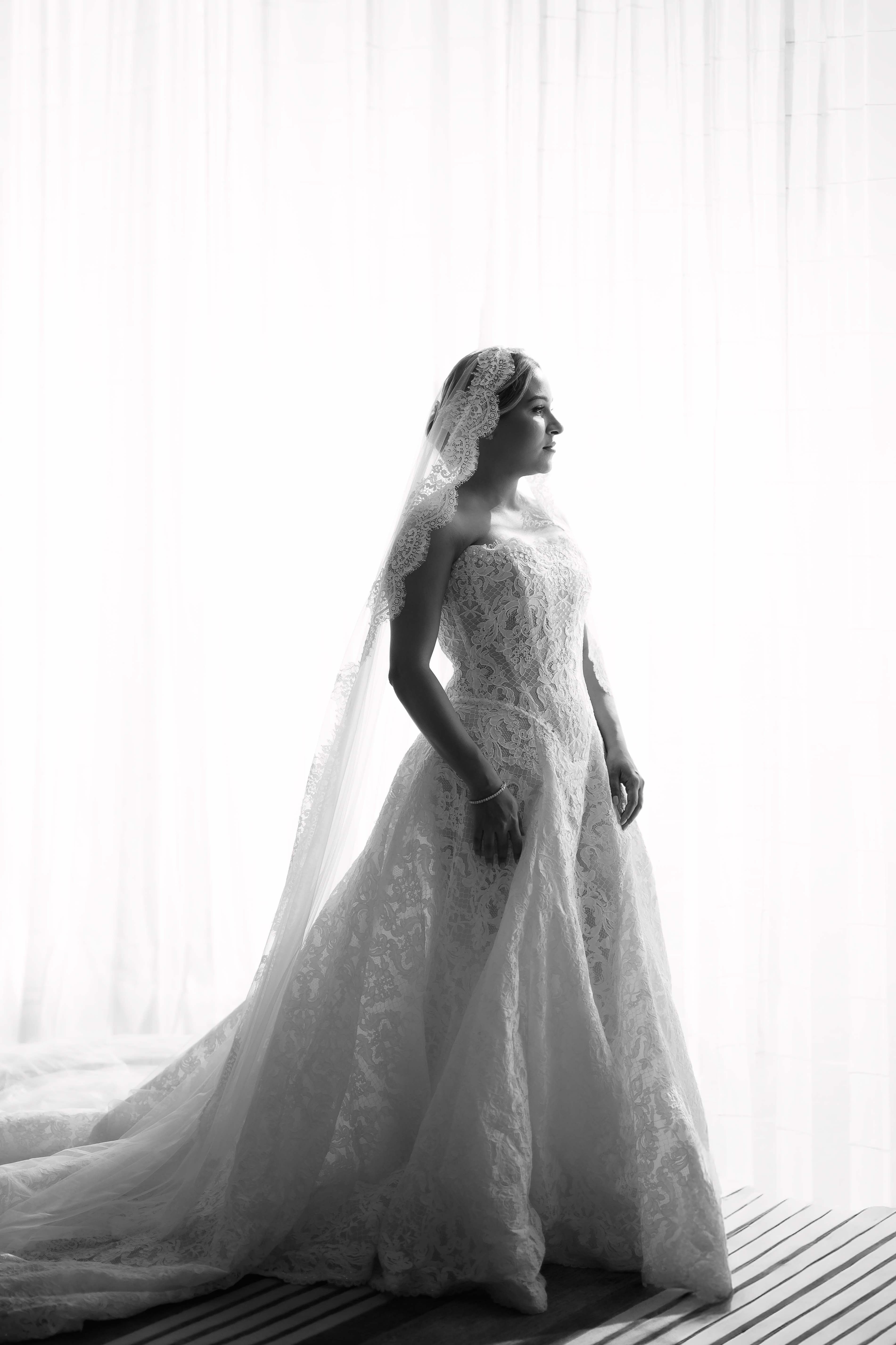 GL Bride Yamilca wearing our Splendid  in a wedding dress with a long train.