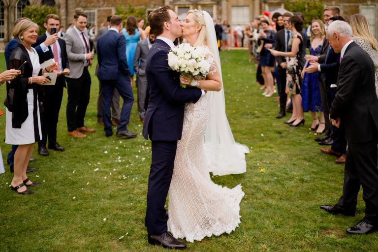 GL Bride Charlotte wearing our Rhiannon kissing her husband 