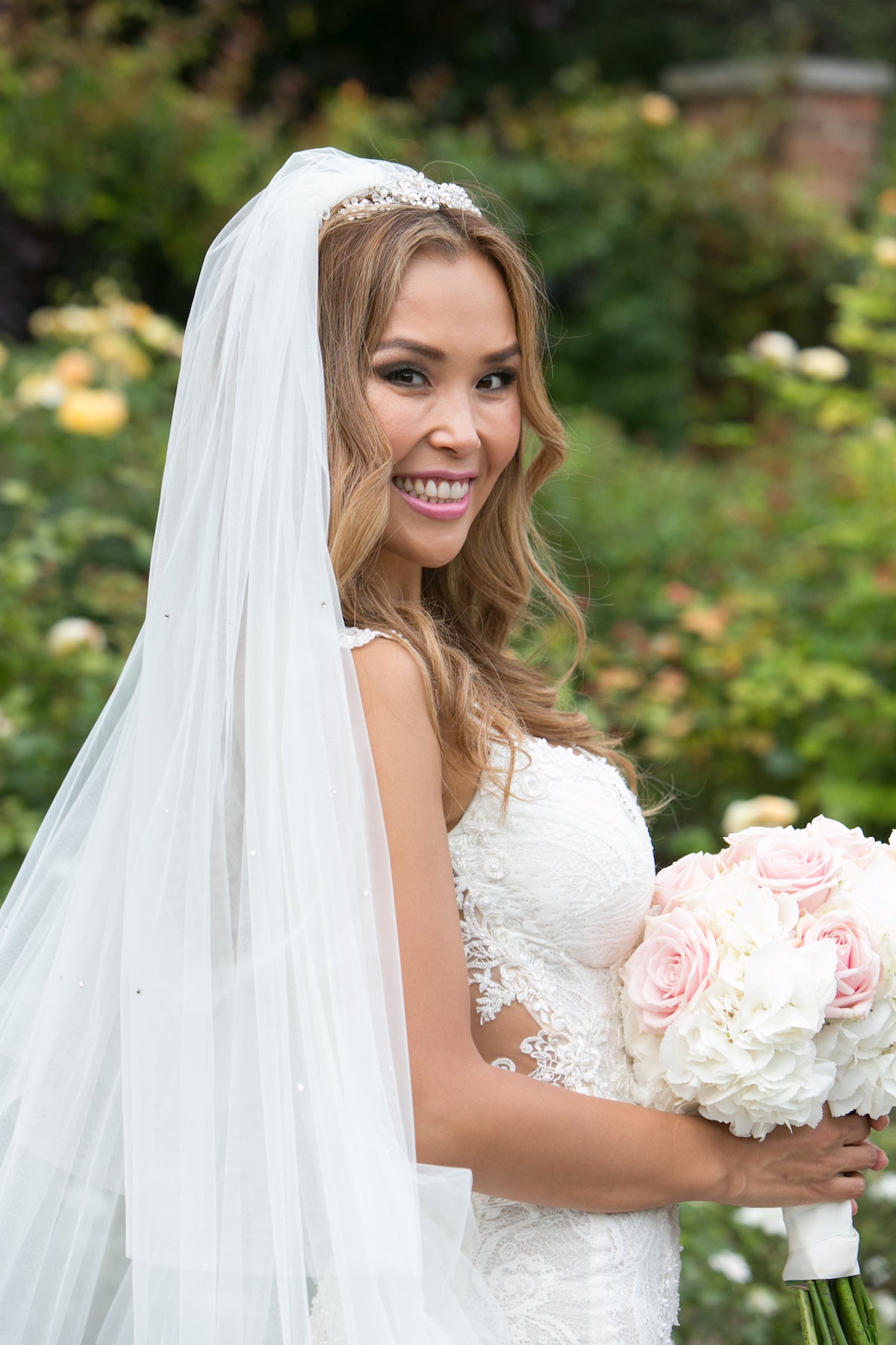 GL Bride Emma wearing the Loretta holding her bouquet 